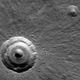 Illustration for article titled Marss remarkable Bulls-Eye Crater could hide underground ice